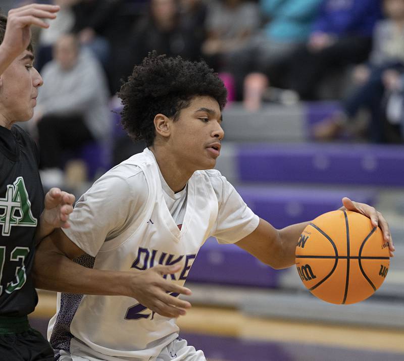 Dixon’s Xavion Jones handles the ball against Alleman Wednesday, Jan. 28, 2026.