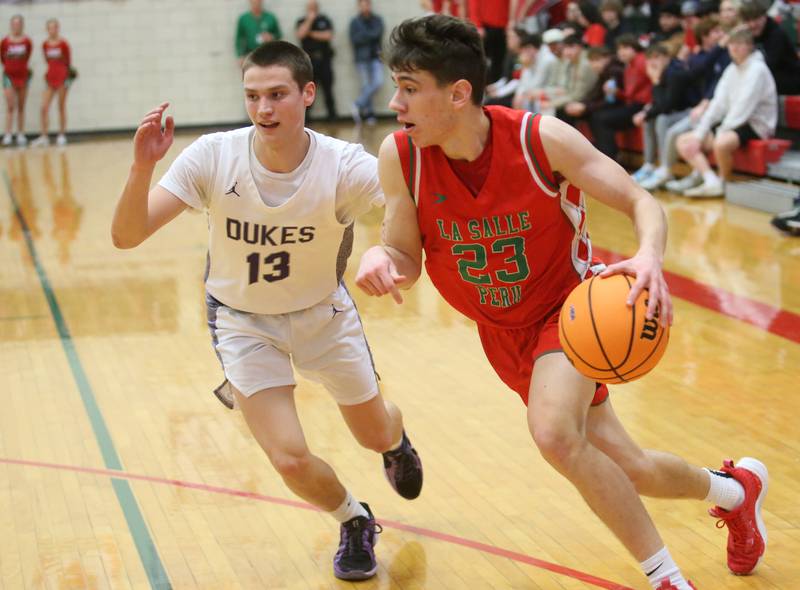 L-P's Nick Olivero dribbles around Dixon's Cullen Shaner during the Class 3A Regional semifinal game on Wednesday, Feb. 26, 2025 in Sellett Gymnasium at L-P High School.
