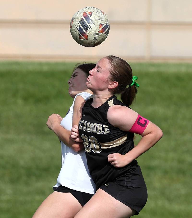 Sycamore's Cortni Kruizenga heads the ball in front of Dixon’s Adysen Johnson during their game Thursday May 15, 2025, at Sycamore High School.