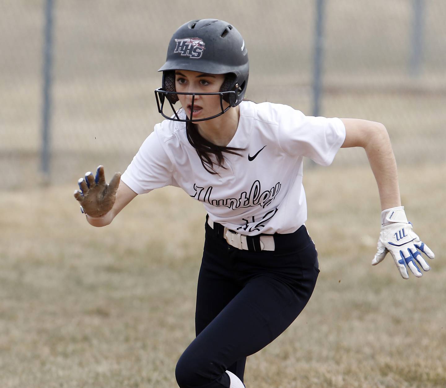 Huntley’s Katie Mitchell runs to home plate after the ball was overthrown as she slide into third base during a non-conference softball game Thursday March 17, 2022, between Huntley and Fremd at Huntley High School.