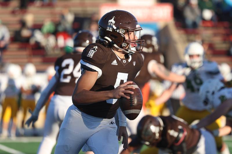 Joliet Catholic’s Andres Munoz looks to pass against Providence in the Class 5A semifinal on Saturday, Nov. 18, 2023, in Joliet.