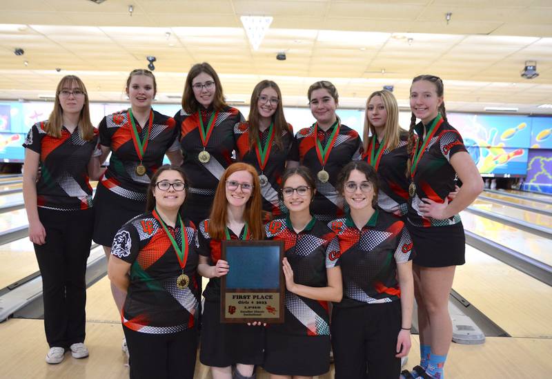 Members of the La Salle-Peru girls bowling team pose with their plaque after winning the Cavalier Classic for the third year in a row.