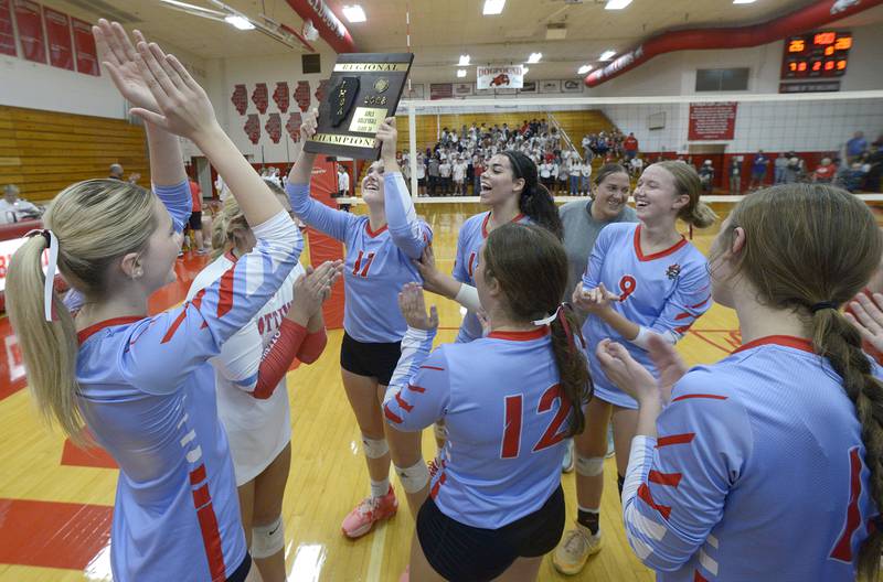 The Ottawa Lady Pirates hold up their Regional Plaque after defeating Streator for the Regional Championship. The Lady Pirates have not won a volleyball Regional since 1995.