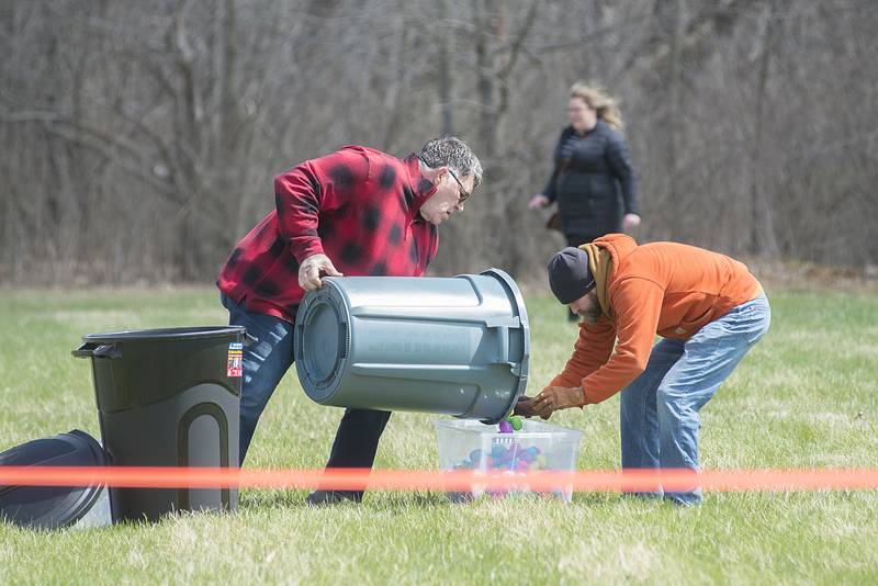 Turning Point CITI Church pastor Don Beasley and Michael Thomas load up a bin of eggs for another “air bunny’ drop.
