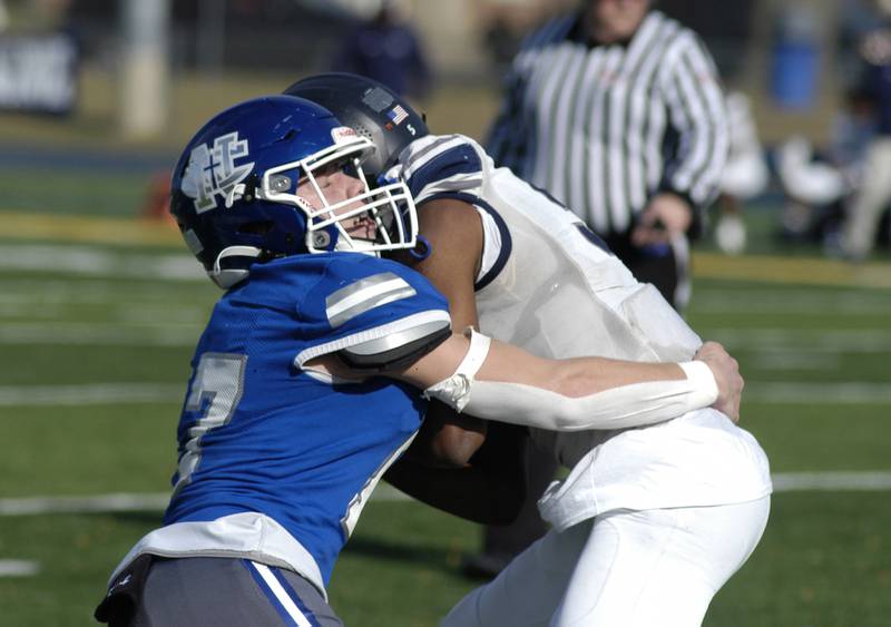 Newman player George Jungerman to take down Chicago Hope's Justin Houston. Newman defeated Chicago Hope 50-22 in Class 1A 1st round football at Sterling High School on Saturday, November 2, 2024.