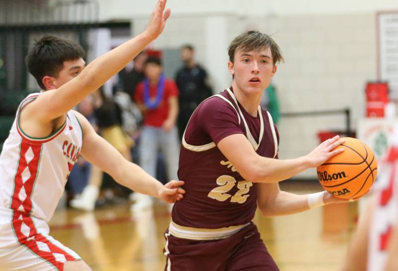 Morris's Brett Bounds looks to pass the ball off as L-P's Erick Sotelo defends on Friday, Dec. 6, 2024 in Sellett Gymnasium at L-P High School.