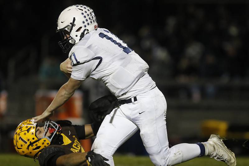 Cary-Grove's Jackson Berndt  flattens Jacobs' Justin Gonzalez as he runs with the ball during a Fox Valley Conference football game on Friday, Oct. 24, 2025, at Jacobs High School in Algonquin.
