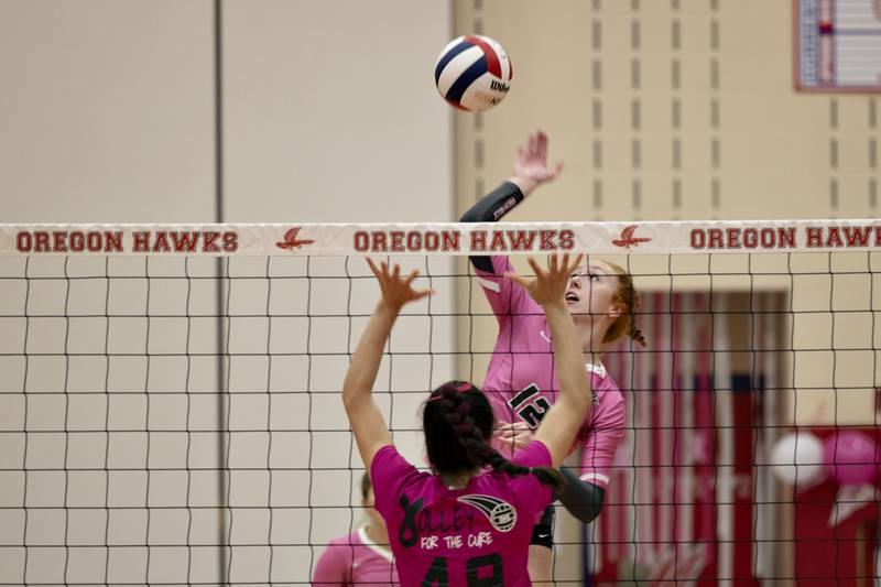 Rock Falls' Emily Lego spikes the ball Tuesday, Oct. 11, 2022 against Oregon.