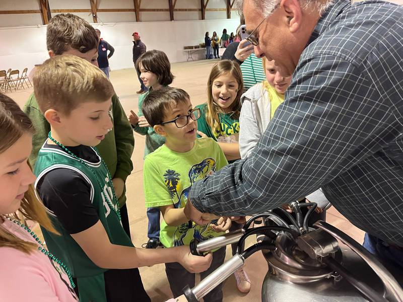 Tim Harris spoke to the students about Dairy during the Bureau County Ag Fair. He explained the journey their milk takes from the cow at the farm to the glass on their tables.  He also allowed showed the students how a milking machine worked.