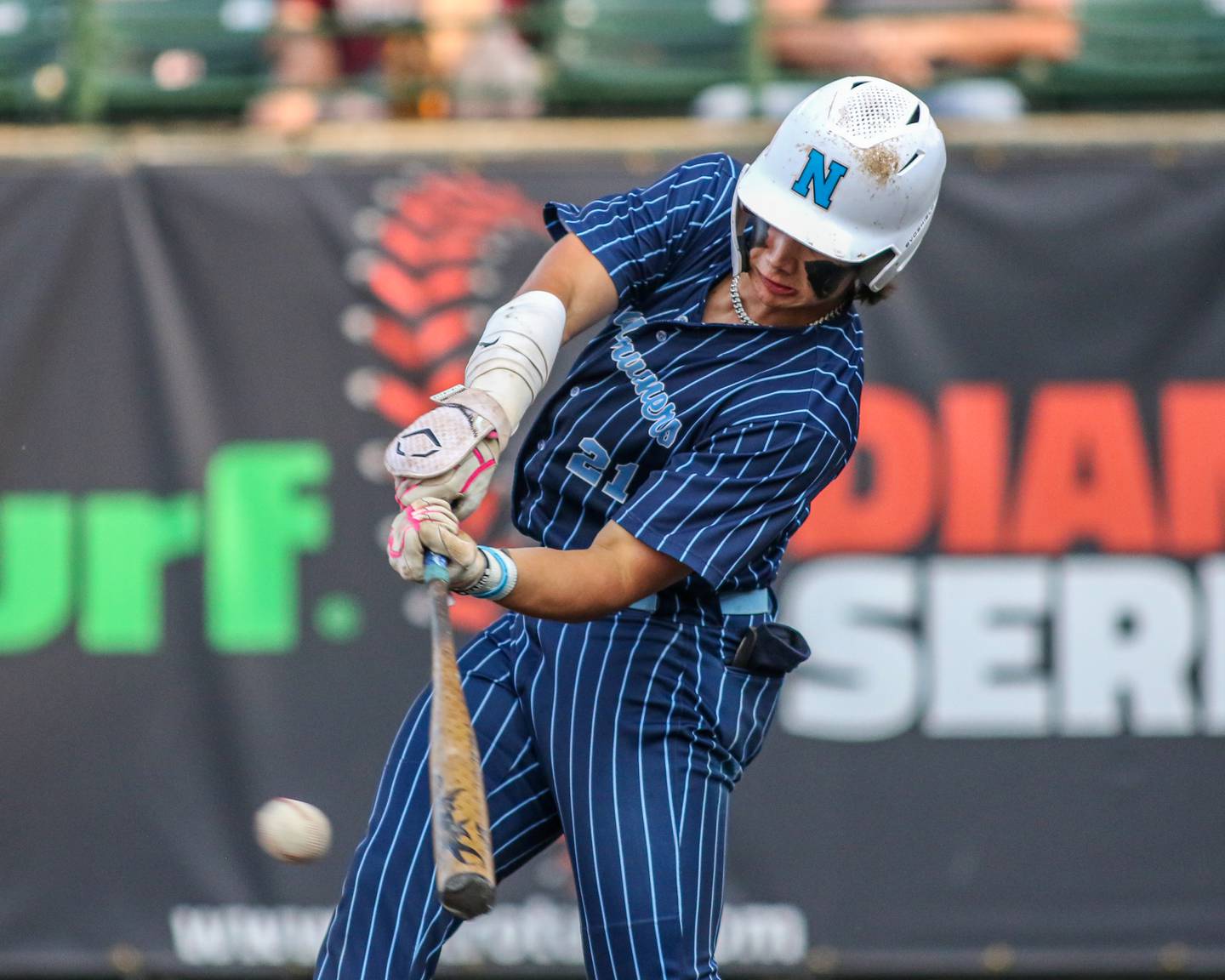 Nazareth's Jaden Fauske (21) swings at a pitch during a Class 3A Crestwood Supersectional game between Lindblom and Nazareth.