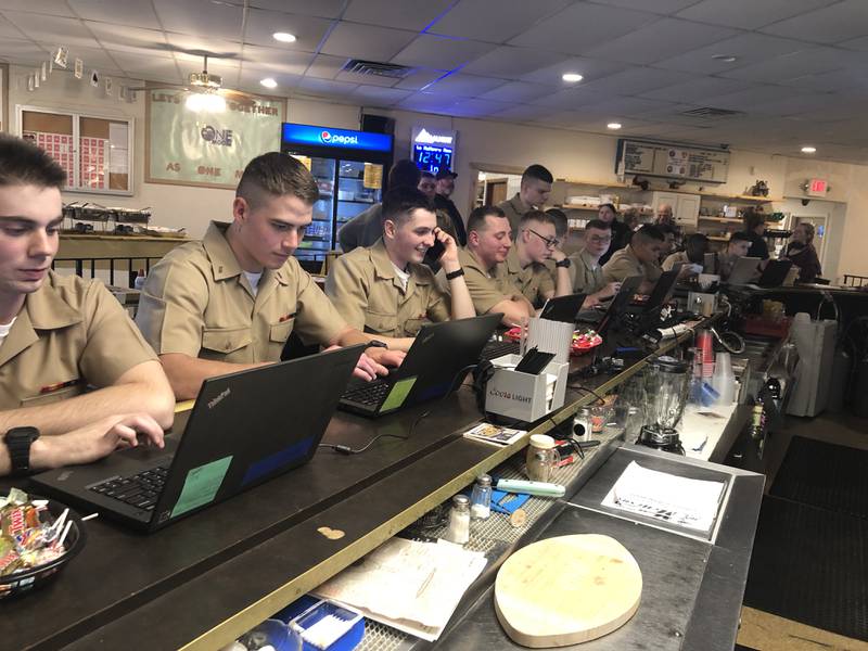 Recruits from the Naval Station Great Lakes' Recruit Training Command used laptop computers and cell phones to call their families on Thursday, Nov. 24, 2022, from the Johnsburg Moose Lodge 691.