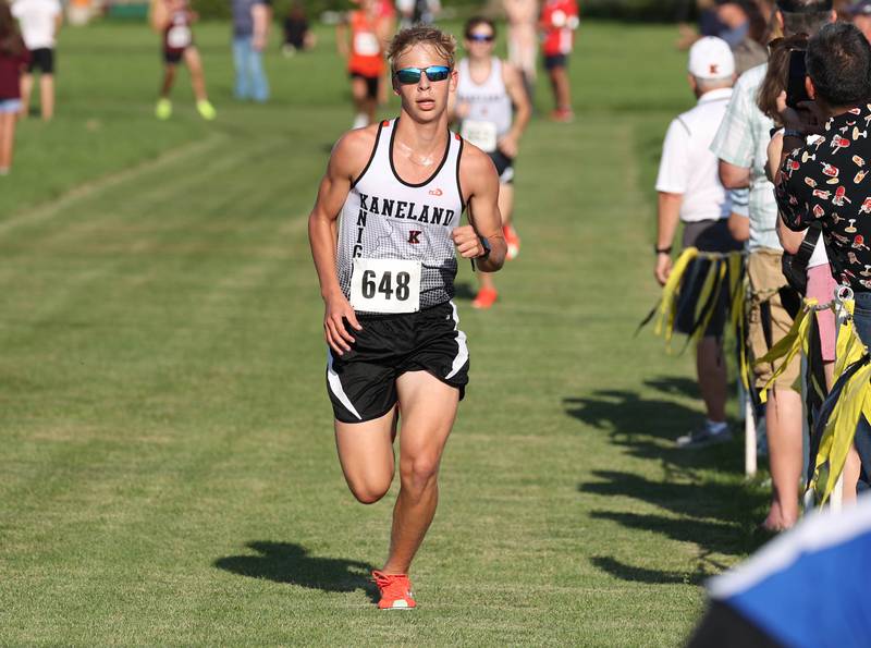 Kaneland’s Nathan Kowalczyk comes to the finish line in fifteenth place in the varsity race Tuesday, Sept. 2, 2025, during the Sycamore Cross Country Invitational at Northern Illinois University in DeKalb.
