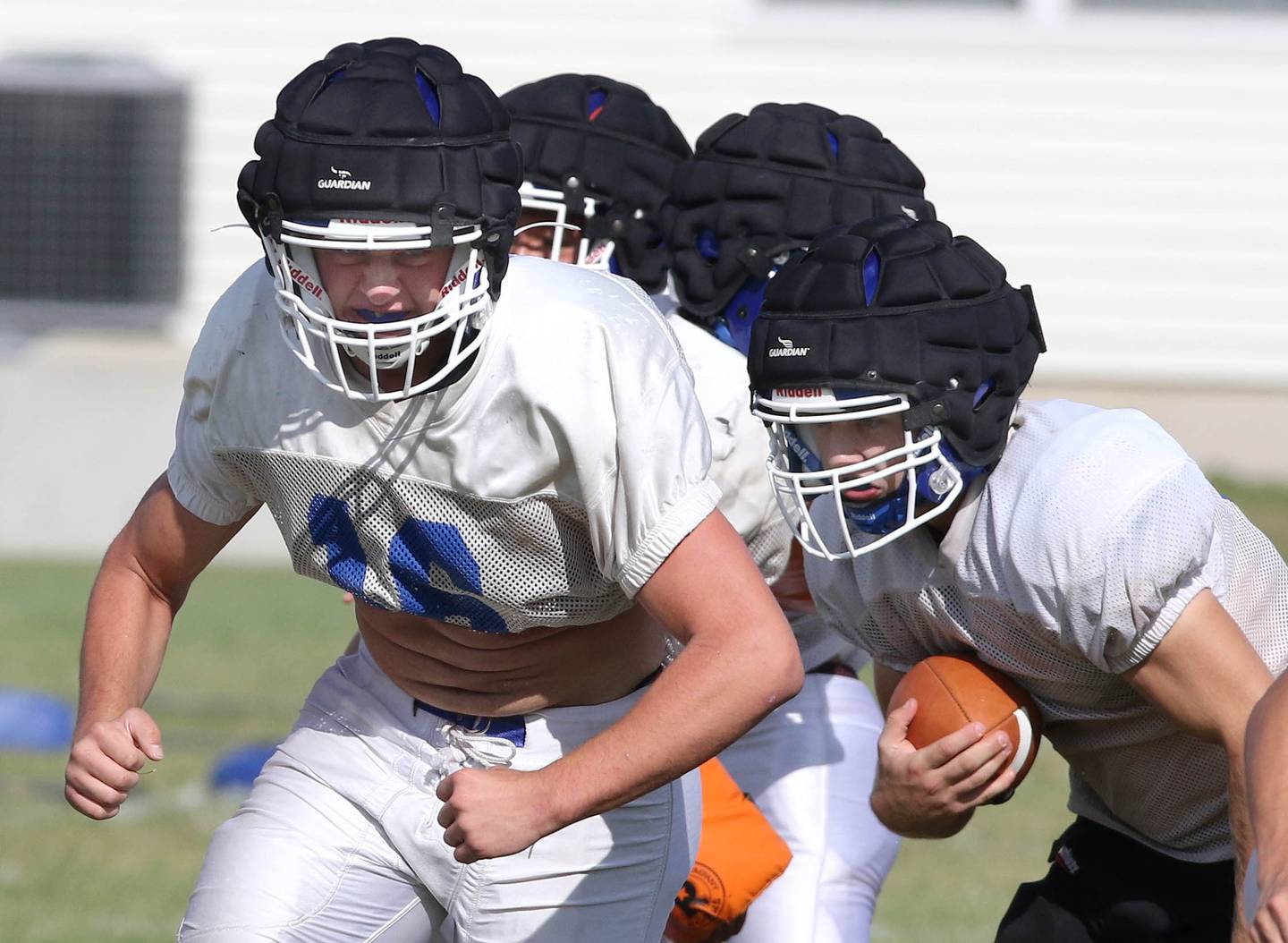 Genoa-Kingston senior offensive lineman Michael Sauber leads a ballcarrier through the hole during practice Wednesday, Sep. 8, 2021 at the school.