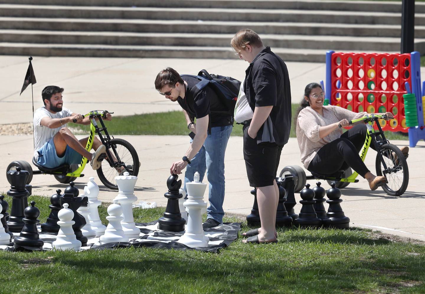 Northern Illinois University students play games and ride bikes Wednesday, April 10, 2024, during Food Truck Wednesday at Northern Illinois University. Food trucks, entertainment and games will all be available on campus from 11 a.m. to 2 p.m. on Food Truck Wednesdays.