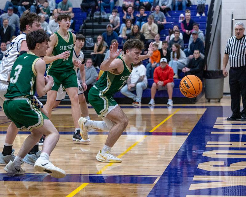 St. Bede's Gino Ferrari (4) steps away as ball falls out of bounds after last being touched by Marquette during the Class 1A Regional Boys Basketball Championship game on Friday, Feb. 27, 2026 at Serena High School.