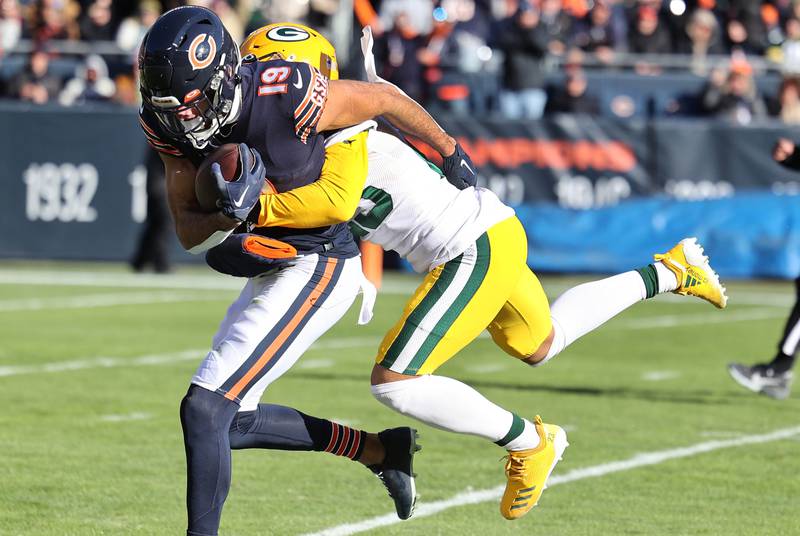 Chicago Bears Equanimeous St. Brown hauls in a long pass and carries Green Bay Packers Jaire Alexander for a few extra yards during their game Sunday, Dec. 4, 2022, at Soldier Field in Chicago.