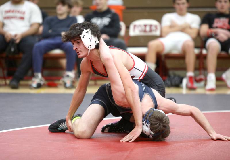 Yorkville’s Dominic Recchia (top) Oswego East’s Braedan Grisham in the 138-pound weight class during a dual meet on Thursday, Jan. 9, 2025 in Yorkville.