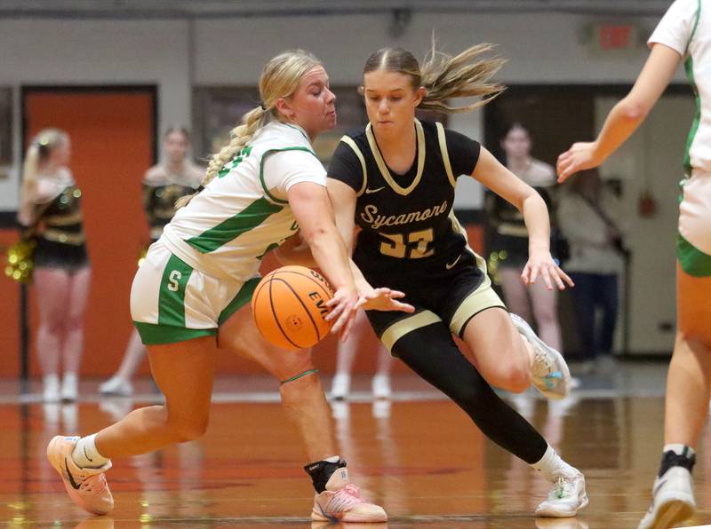 Crystal Lake South’s Laken LePage, left, battles Sycamore’s Quinn Carrier in girls IHSA Class 3A Sectional basketball on Tuesday, Feb. 24, 2026, at Crystal Lake Central High School in Crystal Lake.