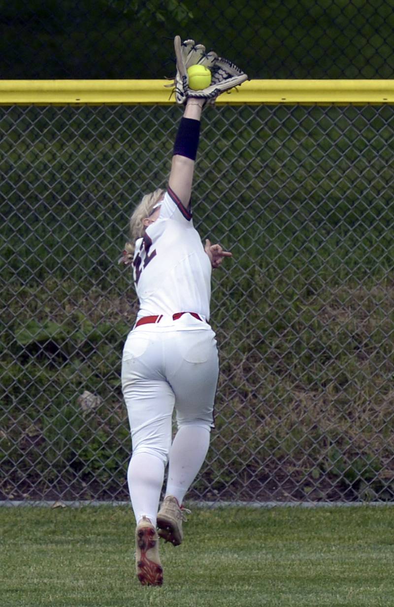 Ottawa left fielder Reese Purcell makes an over-the-shoulder catch deep in left field Wednesday against La Salle-Peru.