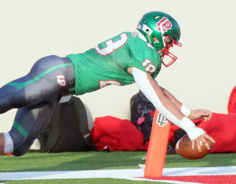La Salle-Peru's Drake Weber dives into the end zone for a touchdown during the Cavaliers' 35-6 win over Ottawa in Week 4.