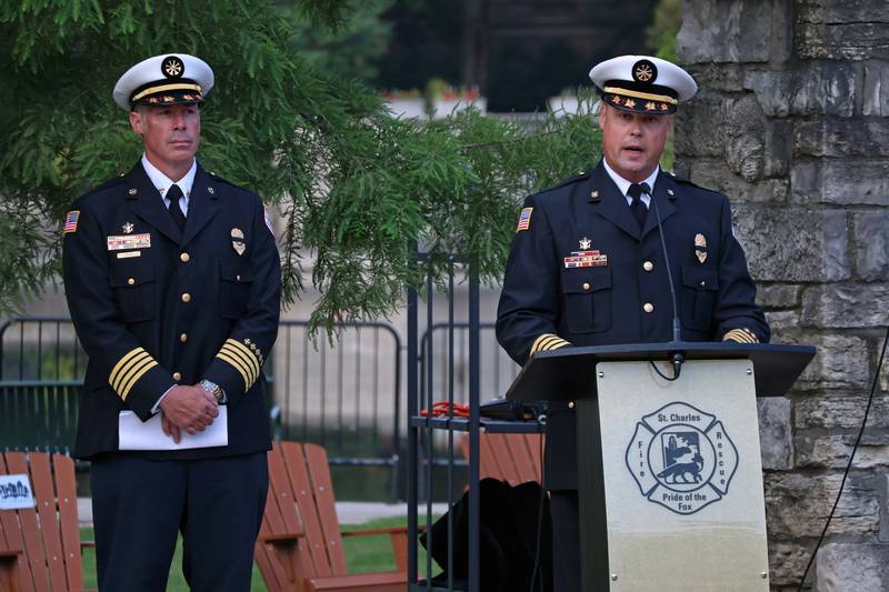 The St. Charles Fire Department Deputy Chief of Operations Jason Peterson (right) and Deputy Chief of Administration Tony Cavallo (left) speak to the crowd during the 9/11 Remembrance Ceremony at the Memorial Monument in downtown St. Charles on Sept. 11, 2025.