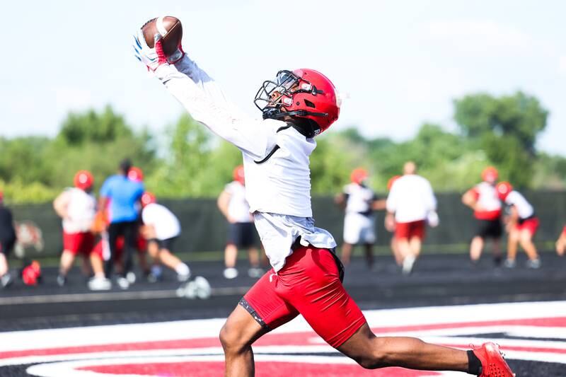Bolingbrook’s Kyan Berry-Johnson stretches for the catch during the first day of practice on Monday, Aug. 7, 2023 in Bolingbrook.