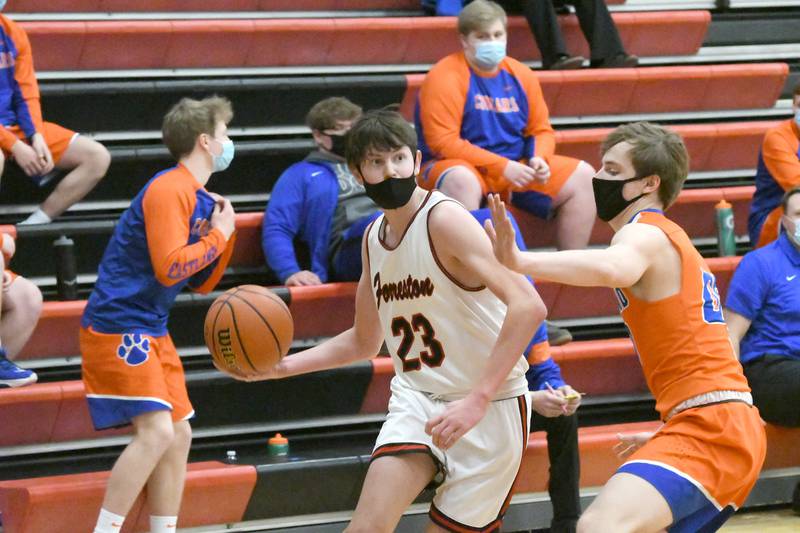 Forreston's Brock Smith gets ready to pass as Eastland's Kellen Henze defends during Feb. 20 action in Forreston.