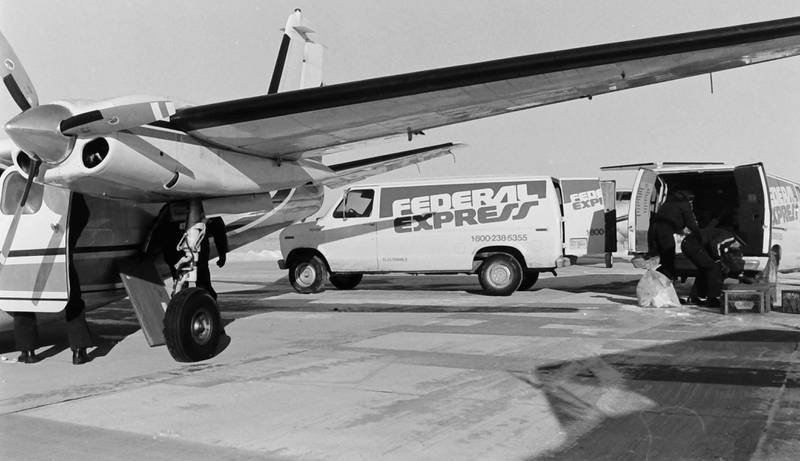 Federal Express (FedEx) employees brave bitter cold winds to unload 2,500 pounds of cargo at the Illinois Valley Regional Airport on Wednesday, Dec. 19, 1985. The Federal Express delivery marked the first major delivery by a commercial airline at the Illinois Valley Regional Airport. The company announced Monday that the facility will permanently close FedEx ship center on Sept. 27, 2025 at 3708 Progress Blvd in Peru.