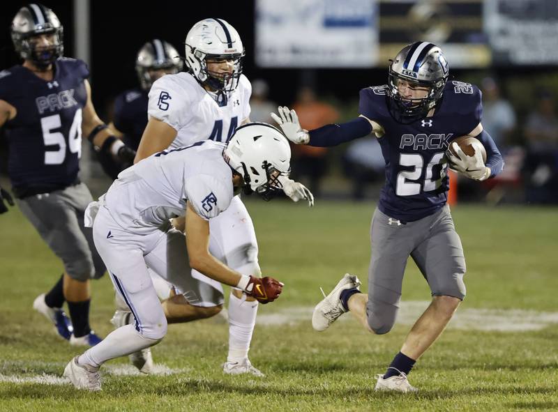 Oswego East's Andrew Pohlman (20) runs the ball during the varsity football game between Plainfield South and Oswego East on Friday, Sep. 20, 2024 in Oswego.