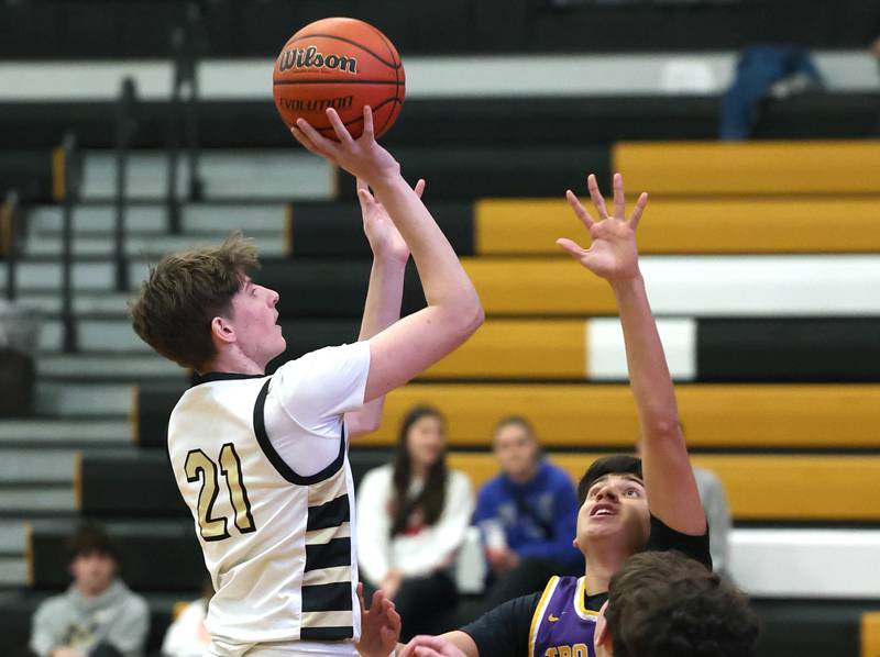 Sycamore's Ben Larry gets off a shot in the lane during their game against Mendota Wednesday, Dec. 13, 2023, at Sycamore High School.