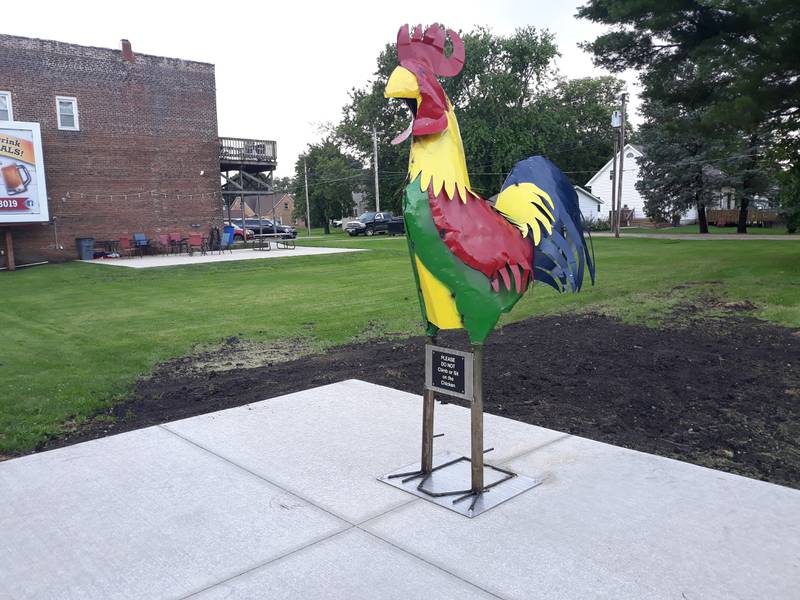 An 8-foot tall chicken sculpture was unveiled in the village of Ladd.