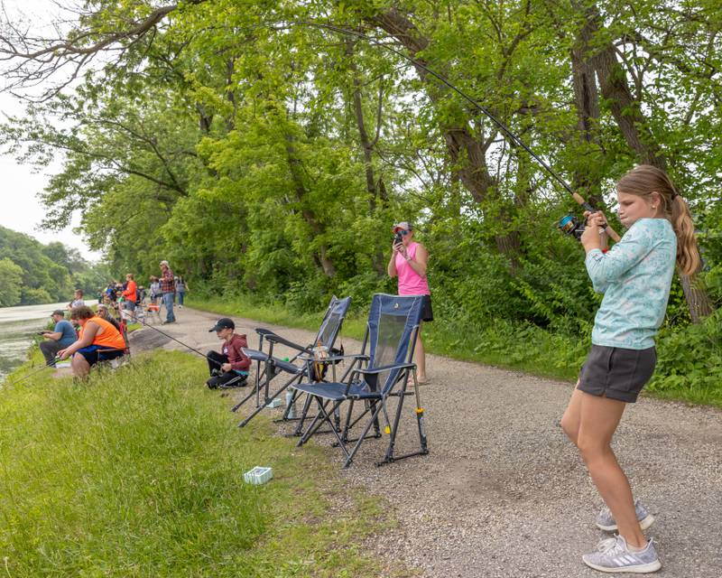 Sawyer Booras braces to keep tension on the line as she fights a catfish during the 38th Annual Kid's Free Fishing Tournament on June 7, 2025 at Lock 14 in La Salle.