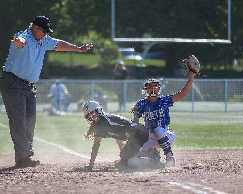 St Charles North's Ginger Ritter (8) looks for the call at third during the Class 4A Glenbard West Regional Final softball game between Glenbard North at St Charles North.  May 26, 2023.