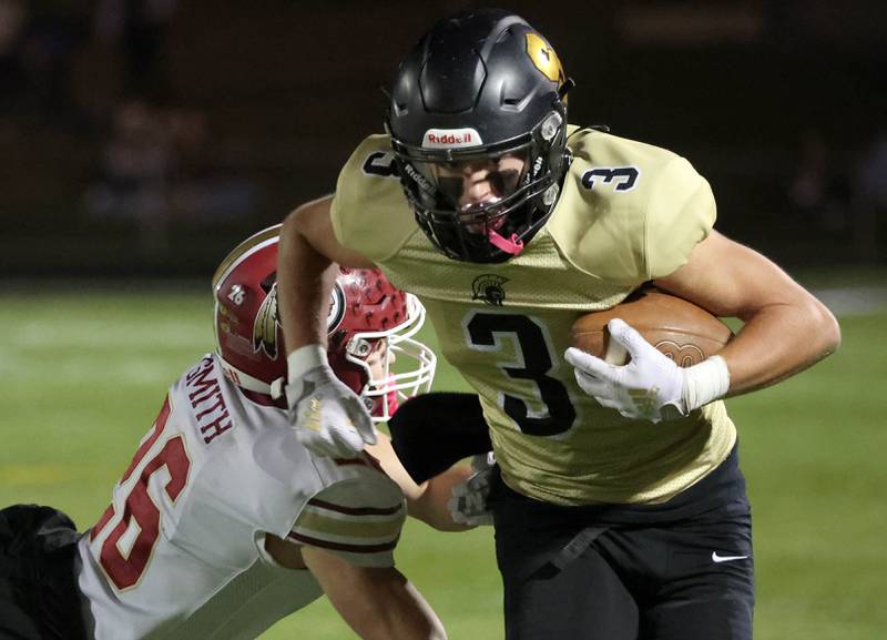 Sycamore's Carter York pulls away from Morris' Mick Smith during their game Friday, Oct. 18, 2024, at Sycamore High School.