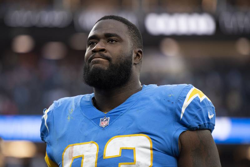 Los Angeles Chargers defensive tackle Justin Jones walks back to the locker room after facing the Denver Broncos on Jan. 2, 2022 in Inglewood, Calif.