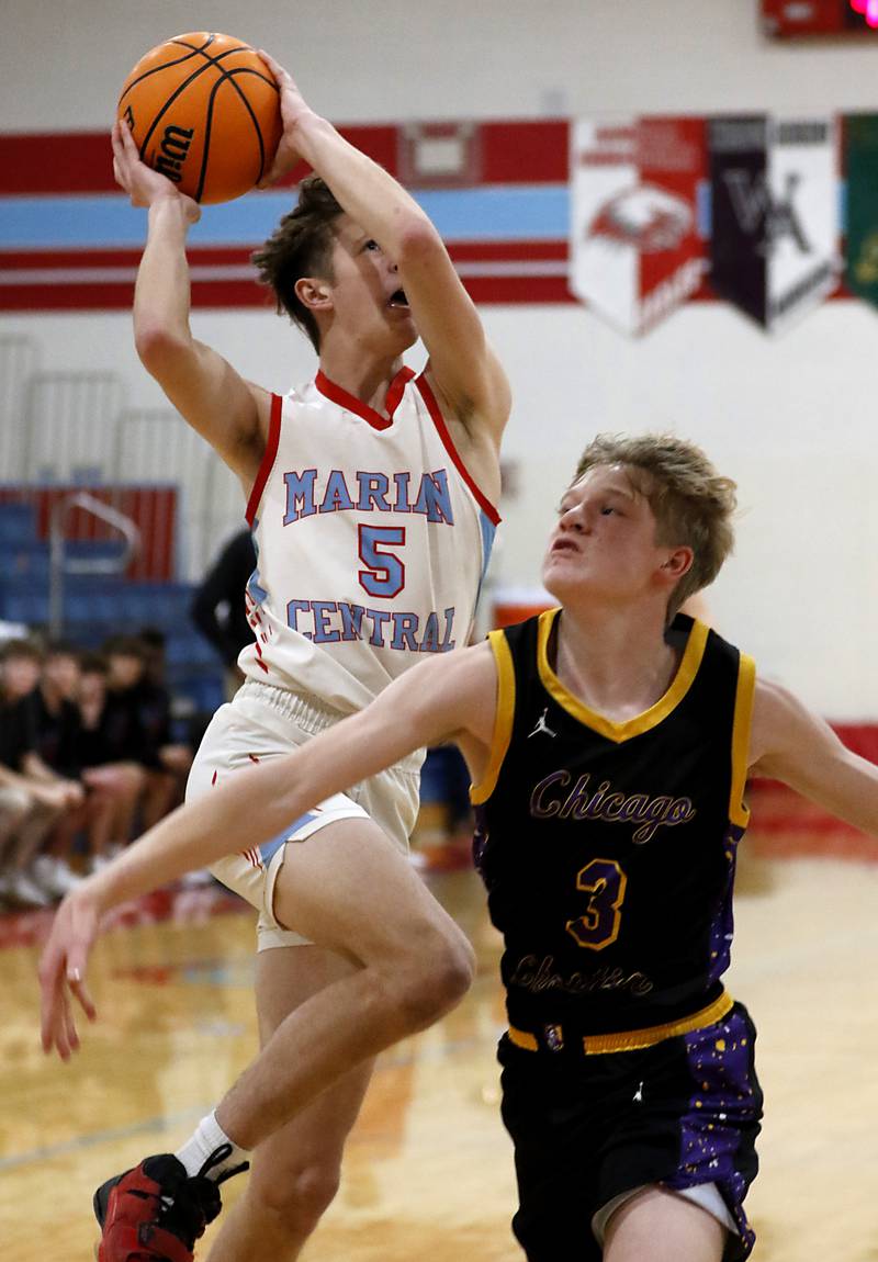 Marian Central's Derek Leitzen drives to the basket against Chicago Christian's Garrett Murphy during a Chicagoland Christian Conference basketball game on Tuesday, Jan. 21, 2025, at Marian Central High School.