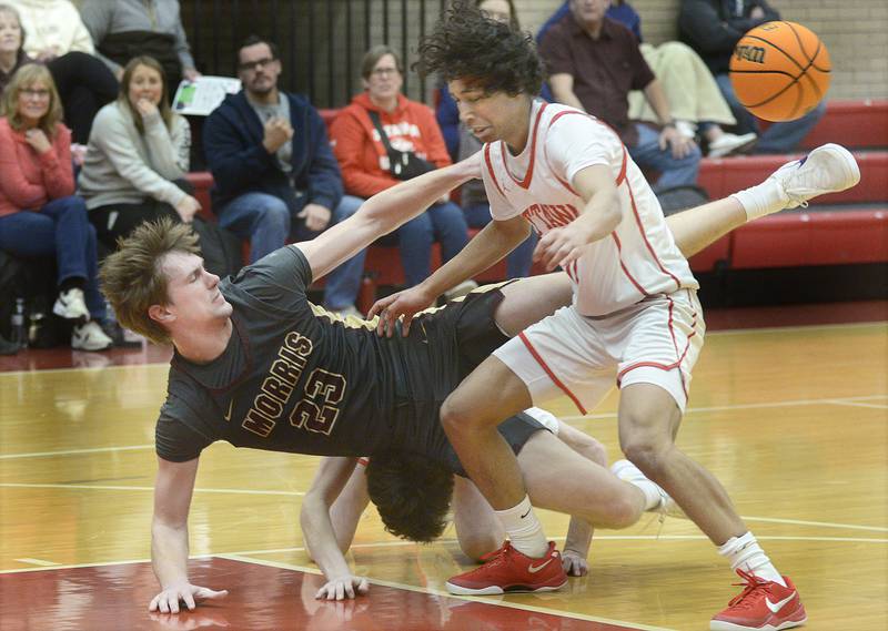 Morris’s Jack Wheeler and Ottawa’s Hezekiah Joachim collide after chasing a loose ball in the 2nd period Tuesday at Ottawa.