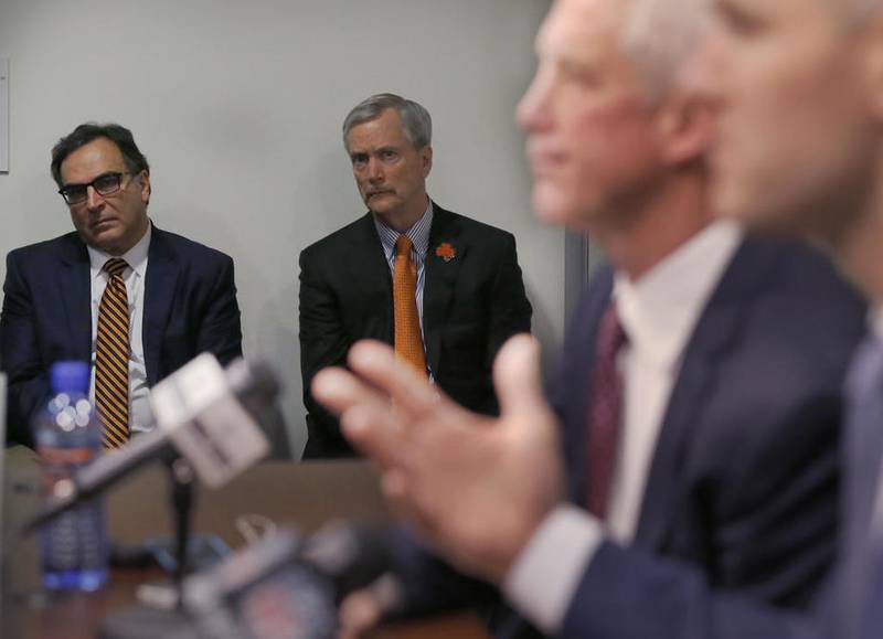 Chicago Bears president Ted Phillips, left and chairman George H. McCaskey, listen to former coach John Fox and general manager Ryan Pace during a press conference in Jan. 2017.