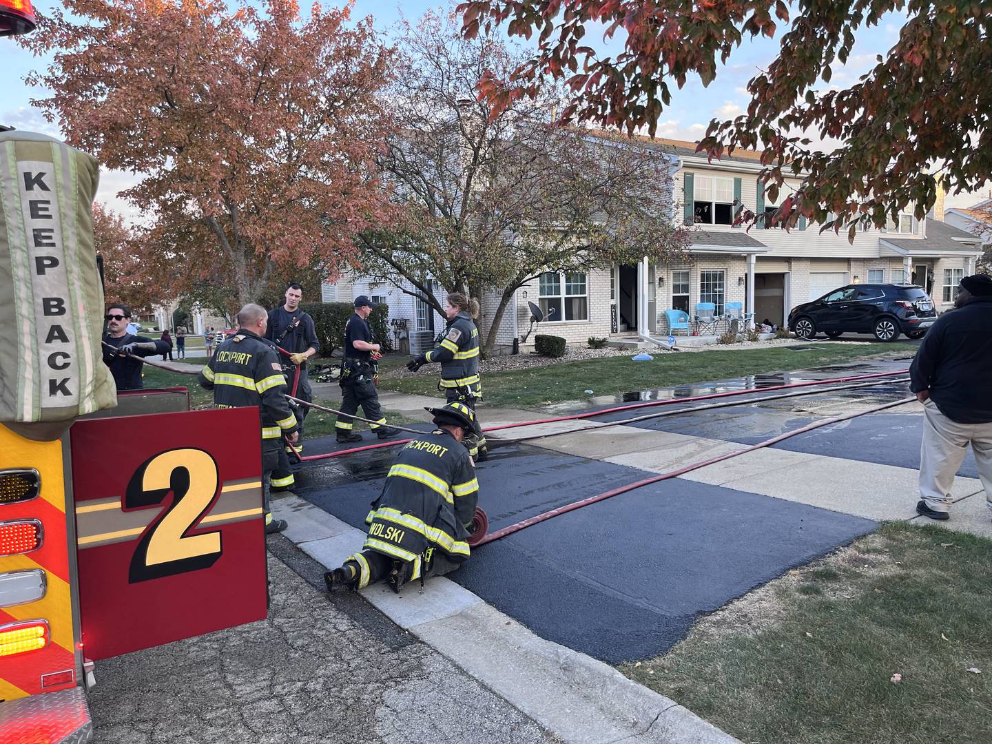 Firefighters with Lockport Township Fire Protection District respond to a fire on Tuesday, Oct. 22, 2024, in the 1400 block of Root Street. Brandon Watt, 39, was charged with aggravated arson following an investigation of the fire.