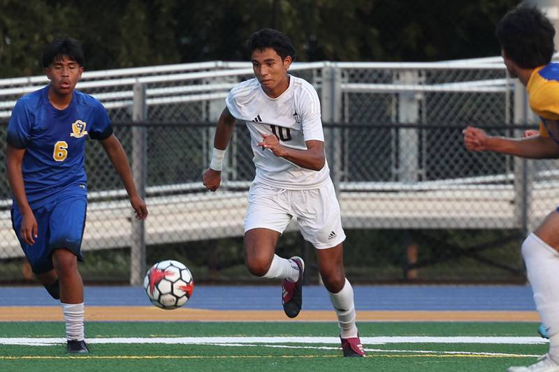 Joliet Catholic’s Diego Rios works the ball upfield against Joliet Central on Monday, Sept. 9, 2024 in Joliet.