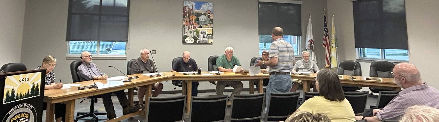 Polo Area Community Theatre board member Hart DuBois (standing) speaks to the Buffalo township Board Wednesday, May 14, 2025. The township voted 4-1 to donate the old Town Hall to the not-for-profit theater group.