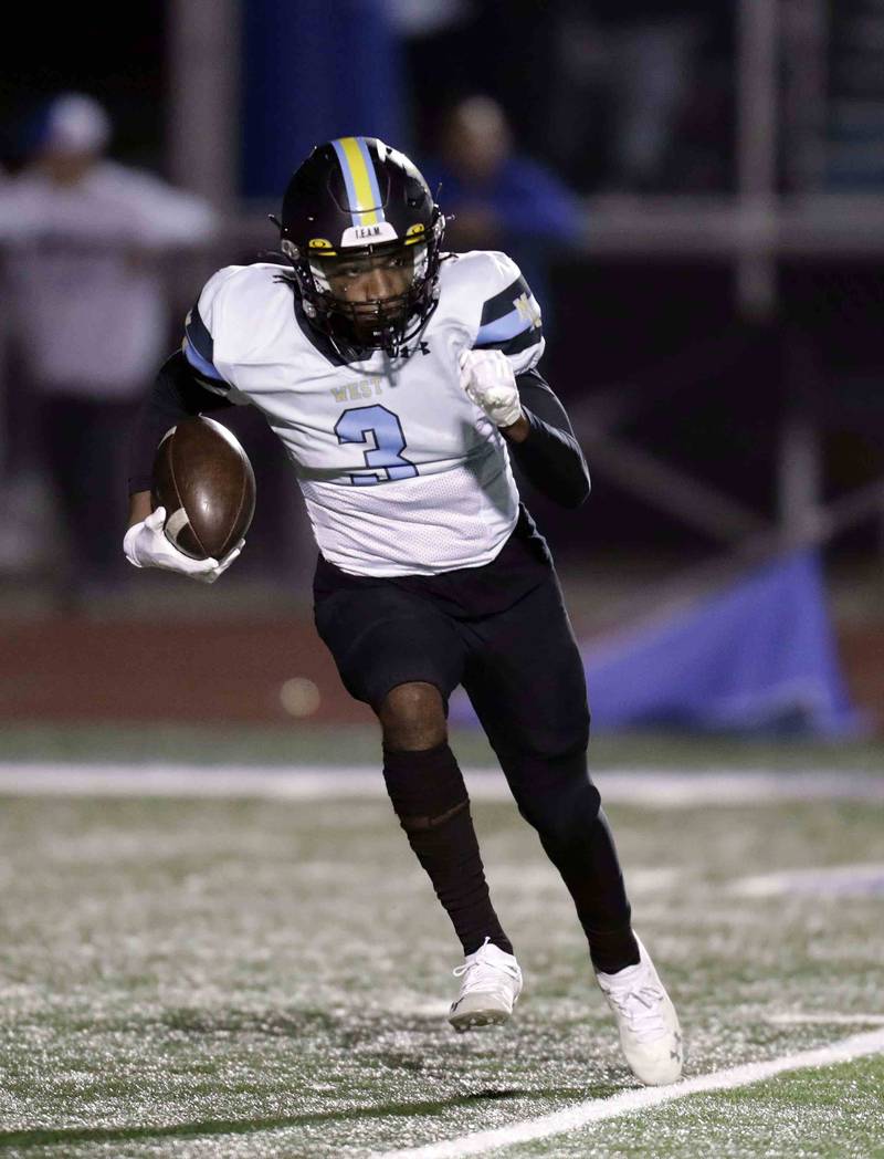 Maine West’s Isaac Pittman (3) returns the ball Friday October 28, 2022 in St. Charles.