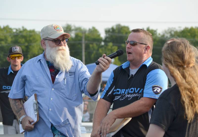 Announcer Tazz Hines and track owner Dan Crownhart are at the starting line before the races on Saturday, Aug. 27, 2022.