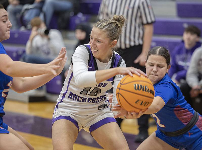 Dixon’s Addy Lohse looks to make a play while being defended by G-K’s Regan Creadon (left) and Ayva Hernandez Tuesday, Jan. 27, 2026.