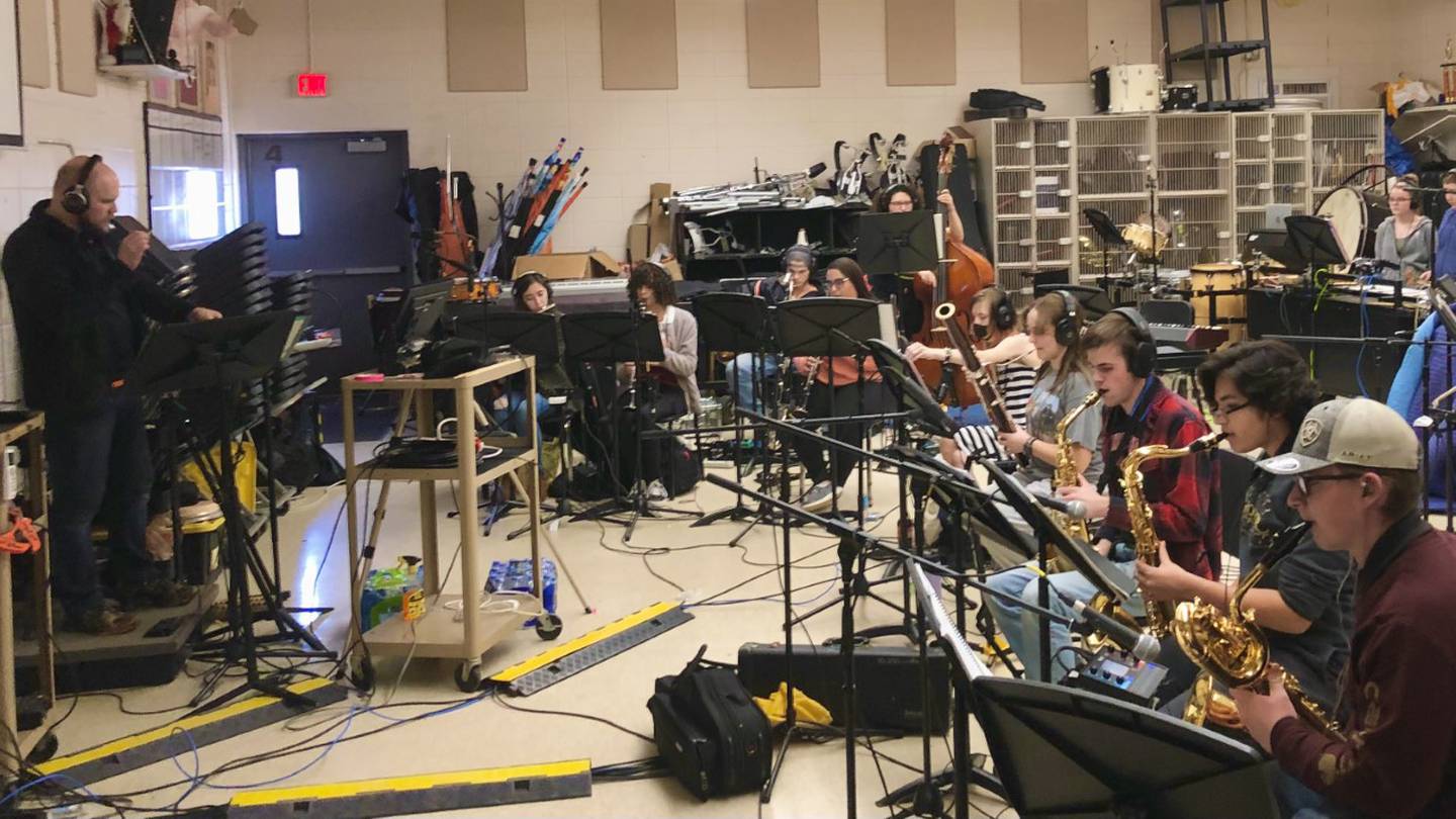 Justin Heinekamp directing band class on Friday March 17 at Sandwich High School.