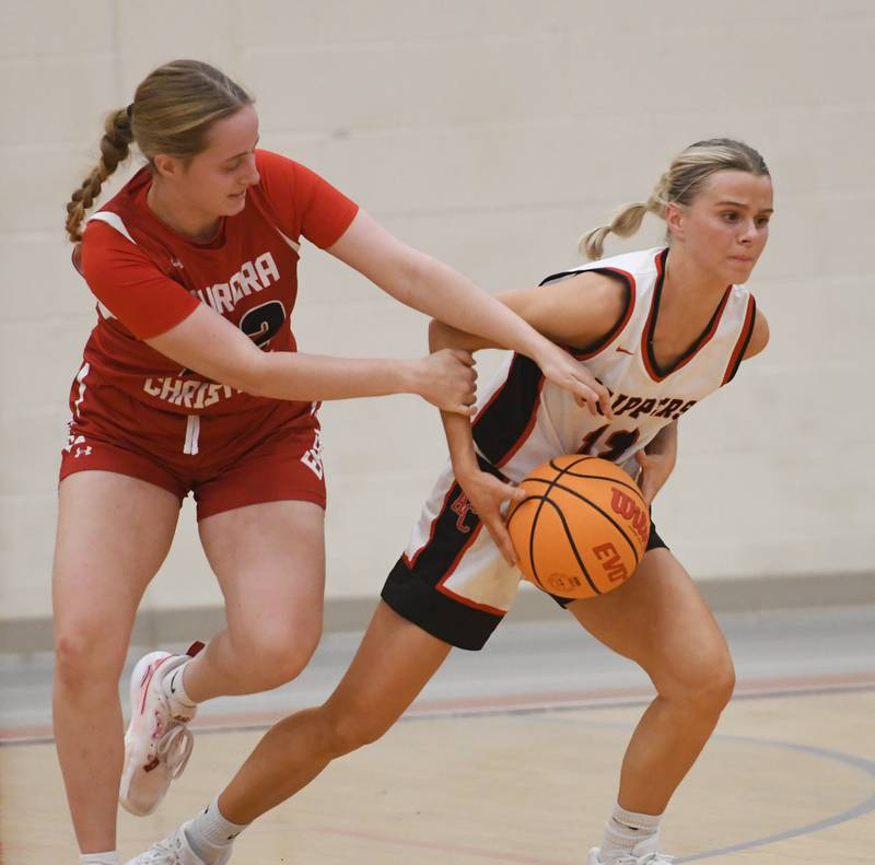 Amboy's Maddie Althaus (12) rips the ball away from an Aurora Christian player at the Oregon Girls Tip-Off Tournament on Wednesday, Nov. 19, 2025 in Oregon.