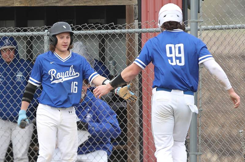 Hinckley-Big Rock's Martin Ledbetter is congratulated after stealing home by Hinckley-Big Rock's Saje Beane during their game Monday, May 1, 2023, at Indian Creek High School in Shabbona.