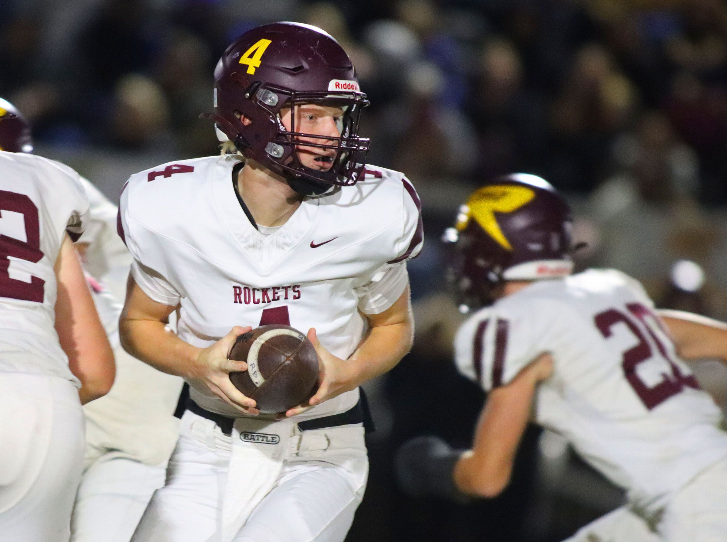 Richmond-Burton’s quarterback Ray Hannemann looks for an option in IHSA football Class 3A second-round playoff action at Bob Stewart Field on the campus of Aurora Central Catholic High School in Aurora on Friday, November 7, 2025.
