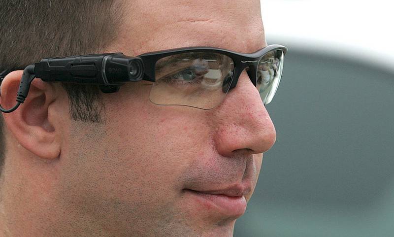 McHenry County Sheriff deputy Eric Woods wears an on-body Taser Flex camera system attached to a pair of glasses during a recent demonstration. Correctional officers at the sheriff's department have used body cameras for years while working in the jail. Patrol deputies will soon begin wearing the camera equipment for a 45-day trial.