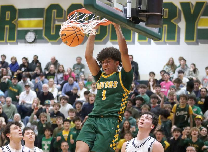 Crystal Lake South’s Noah Cook slams the ball for a fourth-quarter dunk against Cary-Grove in boys IHSA Class 3A Regional Championship basketball on Friday, Feb. 27, 2026, at Crystal Lake South High School in Crystal Lake.